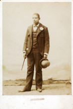 Full length portrait of man with bowler hat and cane, c1890-c1899. Creator: Anderson.