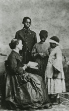 Portrait of teacher Laura M. Towne, a founder of the Penn School, with students..., February 1866. Creator: Unknown.