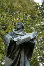Bronze statue of Martin Luther next to the Marienkirche, (St Mary's Church), Berlin, Germany, 2025.  Creator: LTL.