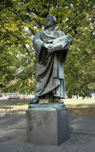 Bronze statue of Martin Luther next to the Marienkirche, (St Mary's Church), Berlin, Germany, 2025.  Creator: LTL.