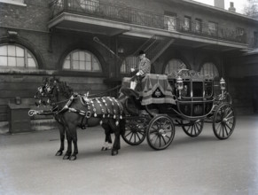 The Irish State Coach, Royal Mews London, 1953.  Creator: Arthur Charles Kirby Ware.