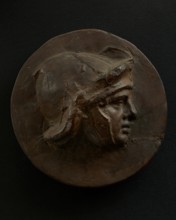 Cast of head of full-faced, young Roman soldier in helmet. Creator: Unknown.