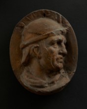 Cast of head of Roman auxiliary in round helmet. Creator: Unknown.