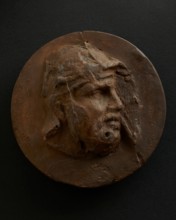 Cast of head of barbarian auxiliary with moustache in helmet. Creator: Unknown.