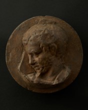 Cast of head of oarsman looking down, with vertical edge of building behind. Creator: Unknown.