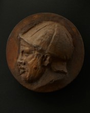 Cast of head of deceased or sleeping Roman auxiliary in helmet. Creator: Unknown.
