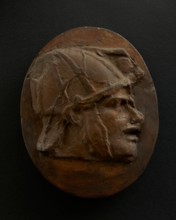 Cast of head of Eastern archer with helmet. Creator: Unknown.