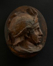 Cast of head of young auxiliary wearing a helmet. Creator: Unknown.