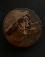 Cast of head of Roman soldier in helmet craning forward. Creator: Unknown.