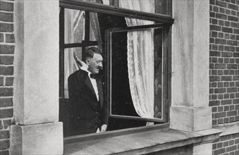 Hitler greeting the crowd at a balcony, 1937
