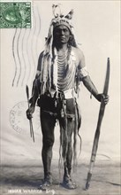 Postcard representing a Stoney warrior with his bow