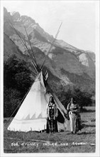 Postcard representing two Stoney  Indian women (indians from Canada) in front of a tepee.