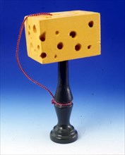 The Cheese Cup-and-Ball Game