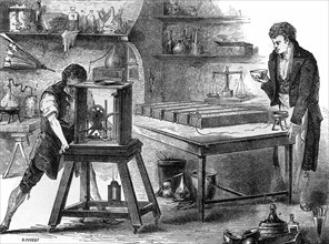 Sir Humphry Davy decomposing the alkalis by means of the voltaic pile (1807)