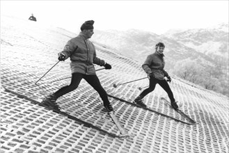 Hilary Best (on the left) and Derek Brightman enjoying skiing on a plastic slope in Scotland (December 16, 1966)