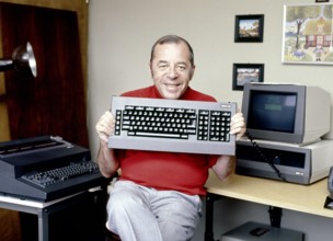Chris HOWLAND with computer keyboard, undated