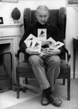 LORIOT with a stack of Loriot books, 1966