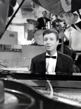 Peter ALEXANDER singing on the piano