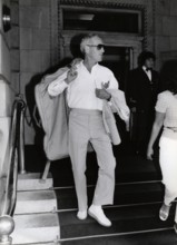 Paul NEWMAN with garment bag