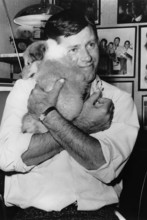 Jerry LEWIS with his dog in his arms