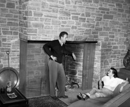 Bob WATERFIELD and Jane RUSSELL in their living room, undated