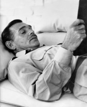 Clark GABLE reading on his farm