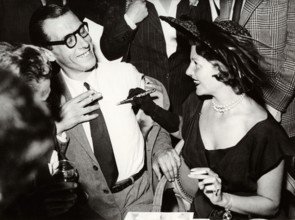 Rita HAYWORTH gives autograph
