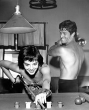 Natalie WOOD and Hugh O'BRIAN playing a game of billiards