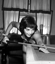 Natalie WOOD playing a game of billiards
