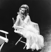 Bibi JOHNS in a director's chair