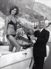 Louis de FUNES congratulates the "Miss Autoroute" 1970