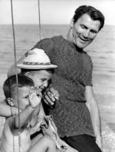 Jack PALANCE with some children at the Lido di Venezia, Venice 1962