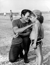 Jack PALANCE with some children at the Lido di Venezia, Venice 1962