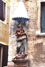 Virgin and child above the devil