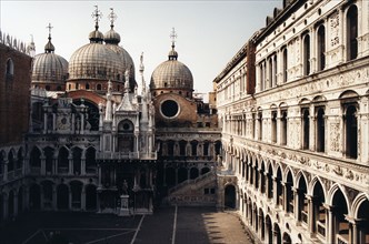 Inner courtyard of the Ducal palace and view towards the Basilica San Marco in Venice