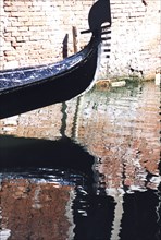 Gondola in Venice, reflections in a canal