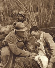 First Aid administered to the injured in the Haudromont ravine near Douaumont Fort