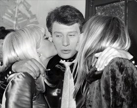 Mar 17, 1967 - Paris, France - JOHNNY HALLYDAY is kissed by his wife SYLVIE VARTAN (L) and FRANCOISE HARDY during the premier of his show at the Olympia Theathre.