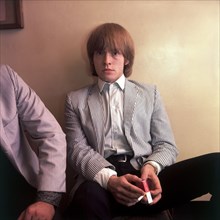 ROLLING STONES guitarist Brian Jones in 1964 is smoking Gold Leaf