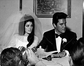 Elvis Presley and Priscilla Presley at their wedding