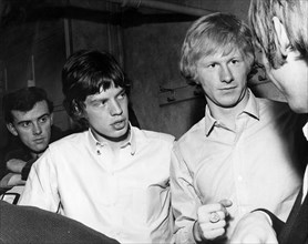 ROLLING STONES Mick Jagger with group manager Andrew Loog Oldman in 1964