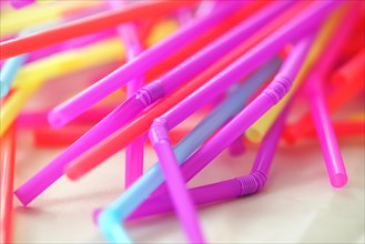 Banning plastic straws enviromental concerns concept, macro close up selective focus.