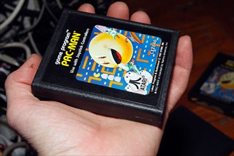 Hand and PacMan Pac-man console game cartridge for Atari.