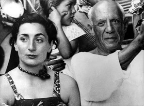 Artist Pablo Picasso and his wife Jacqueline Roque at a bullfight