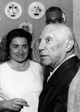 Artist Pablo Picasso with wife Jacqueline Roque at an art opening