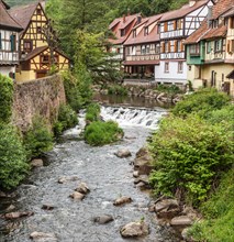 Some of the attractive, half-timbered medieval houses beside the Ruiver Weiss in the village of Kaysersberg, Alsace, France.