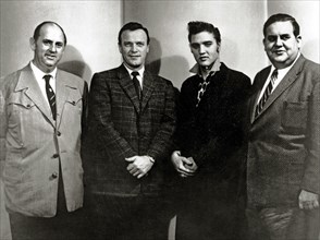 Elvis Presley with Colonel Tom Parker, Eddy Arnold and Steve Sholes at the RCA Recording studios for his last recording session before leaving for his 2 year tour of duty in the Army (March 10th 1958)...