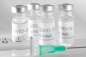 Covid-19 vaccine vials. Coronavirus pandemic infection. Global prevention vaccination