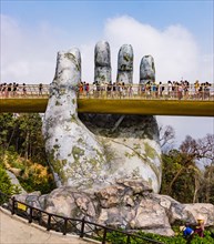 Ba Na Hills, Danang/Vietnam-02/25/2019: the newly opened Golden Bridge supported by a pair of giant hands at the summit of Ba Na Hills