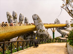 Ba Na Hills, Danang/Vietnam-02/25/2019: the newly opened Golden Bridge supported by a pair of giant hands at the summit of Ba Na Hills